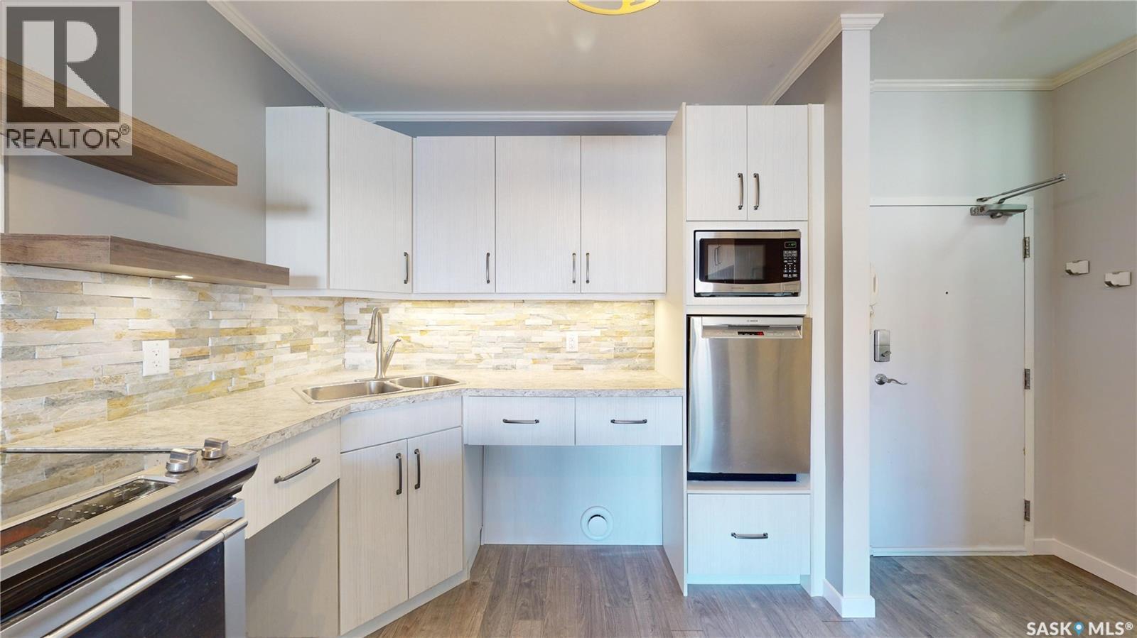 111 720 Baltzan Boulevard, Saskatoon, SK - Indoor Photo Showing Kitchen With Stainless Steel Kitchen With Double Sink