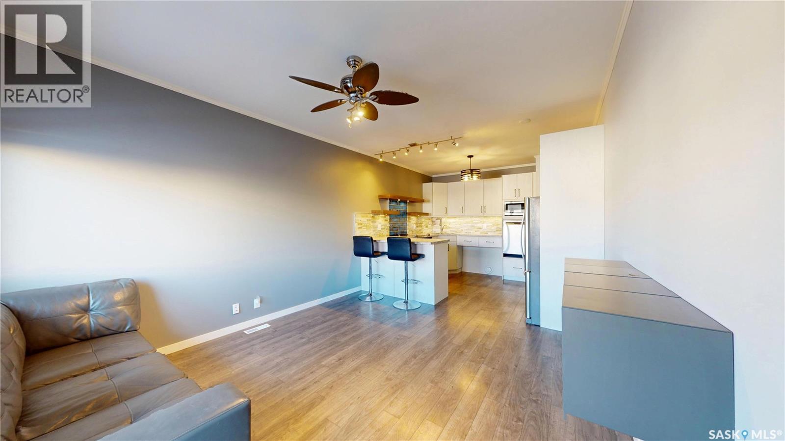 111 720 Baltzan Boulevard, Saskatoon, SK - Indoor Photo Showing Living Room