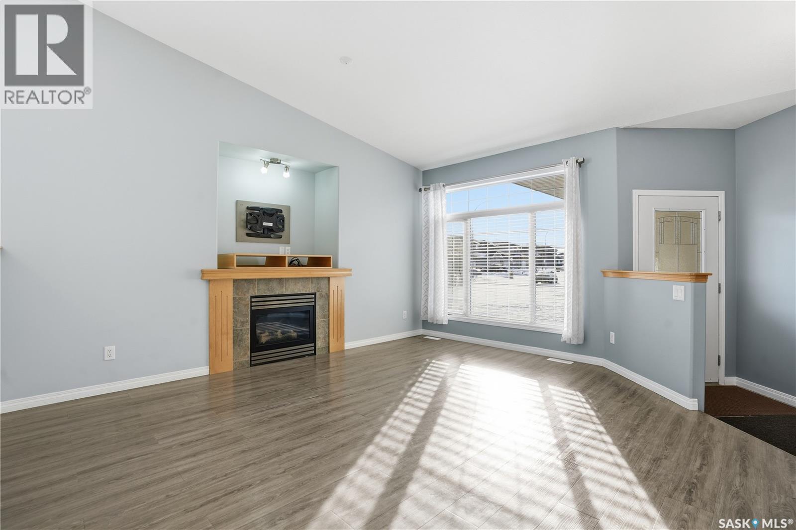 7902 Thrush Street, Regina, SK - Indoor Photo Showing Living Room With Fireplace