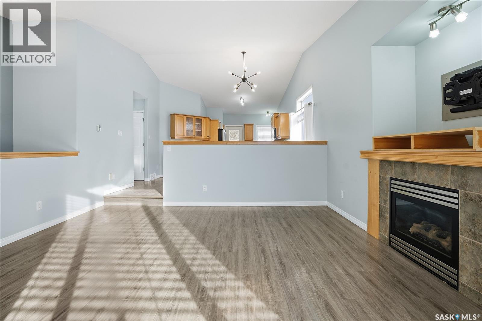 7902 Thrush Street, Regina, SK - Indoor Photo Showing Living Room With Fireplace