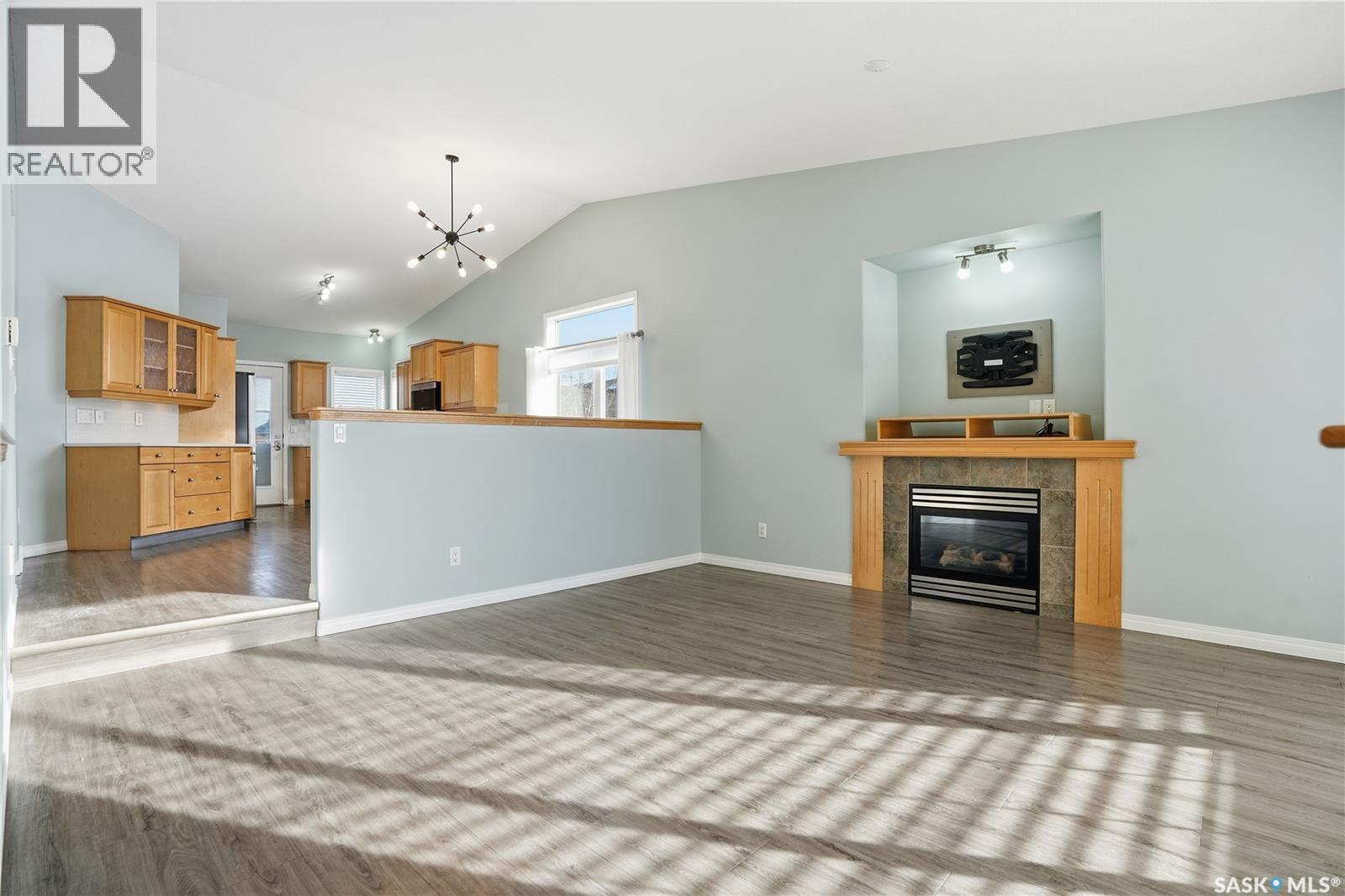 7902 Thrush Street, Regina, SK - Indoor Photo Showing Living Room With Fireplace