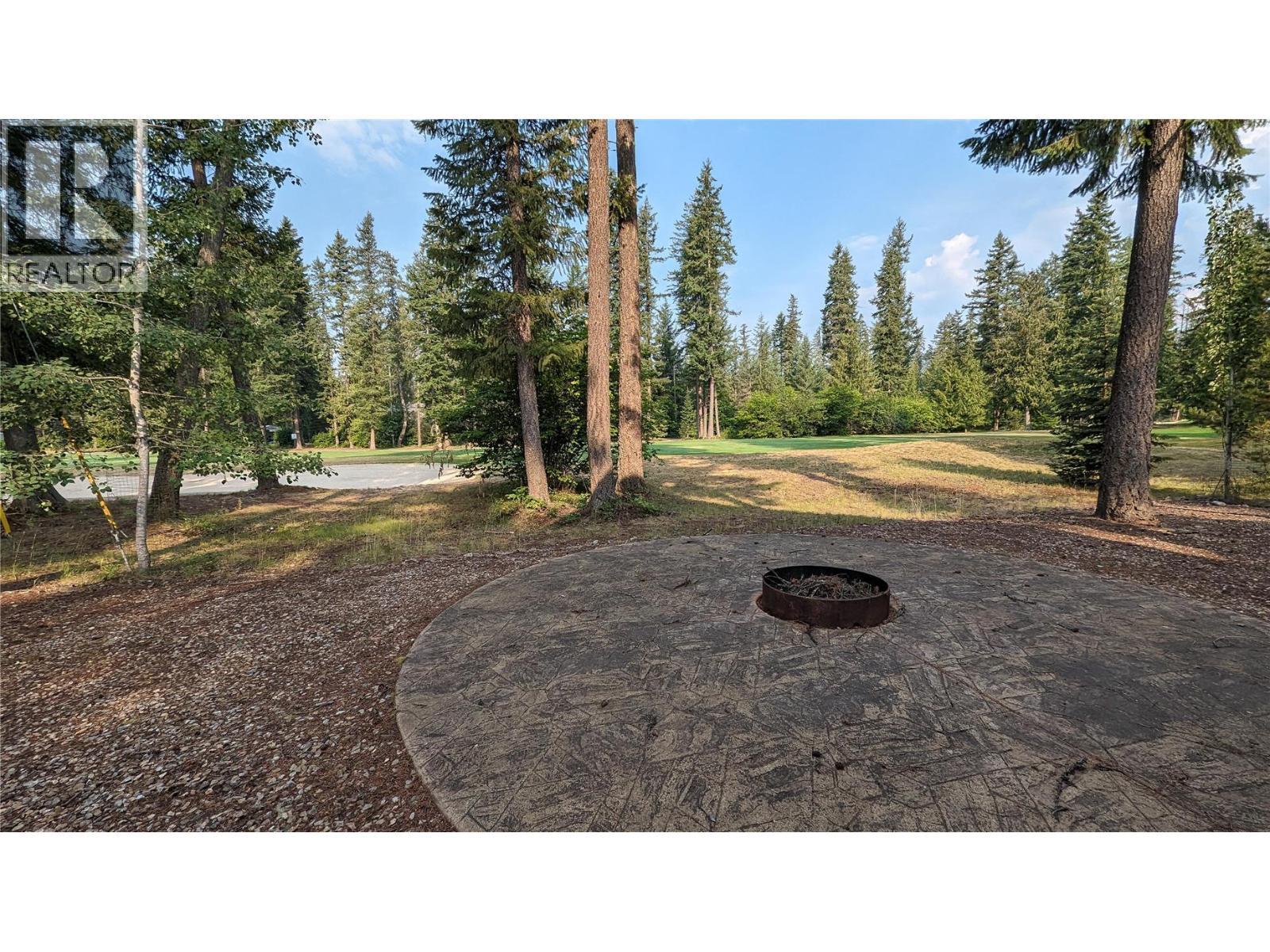Roast your marshmallows while watching the golfers finish their game. Or dine at the clubhouse and return home for s'mores! - 19-3453 Cessna Road, Enderby, BC - Outdoor With View