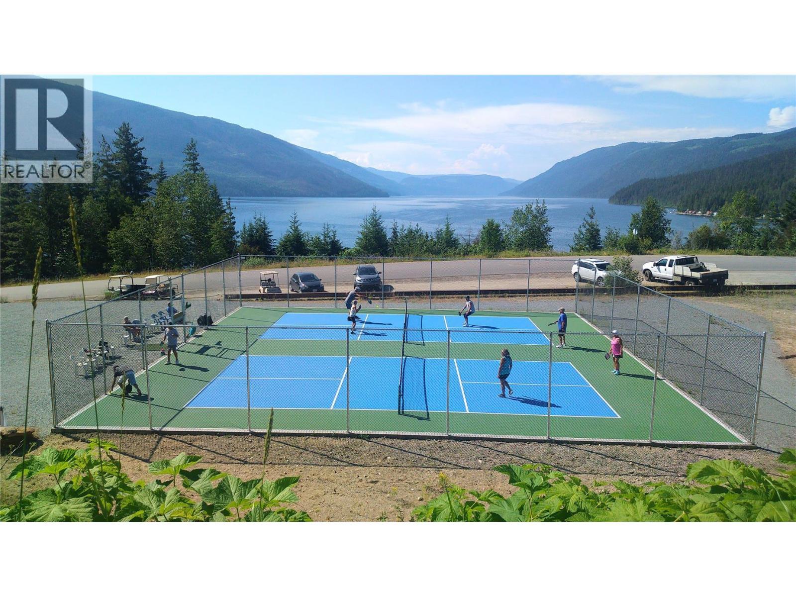 Pickle ball court requires member pass. - 19-3453 Cessna Road, Enderby, BC - Outdoor With Body Of Water With View