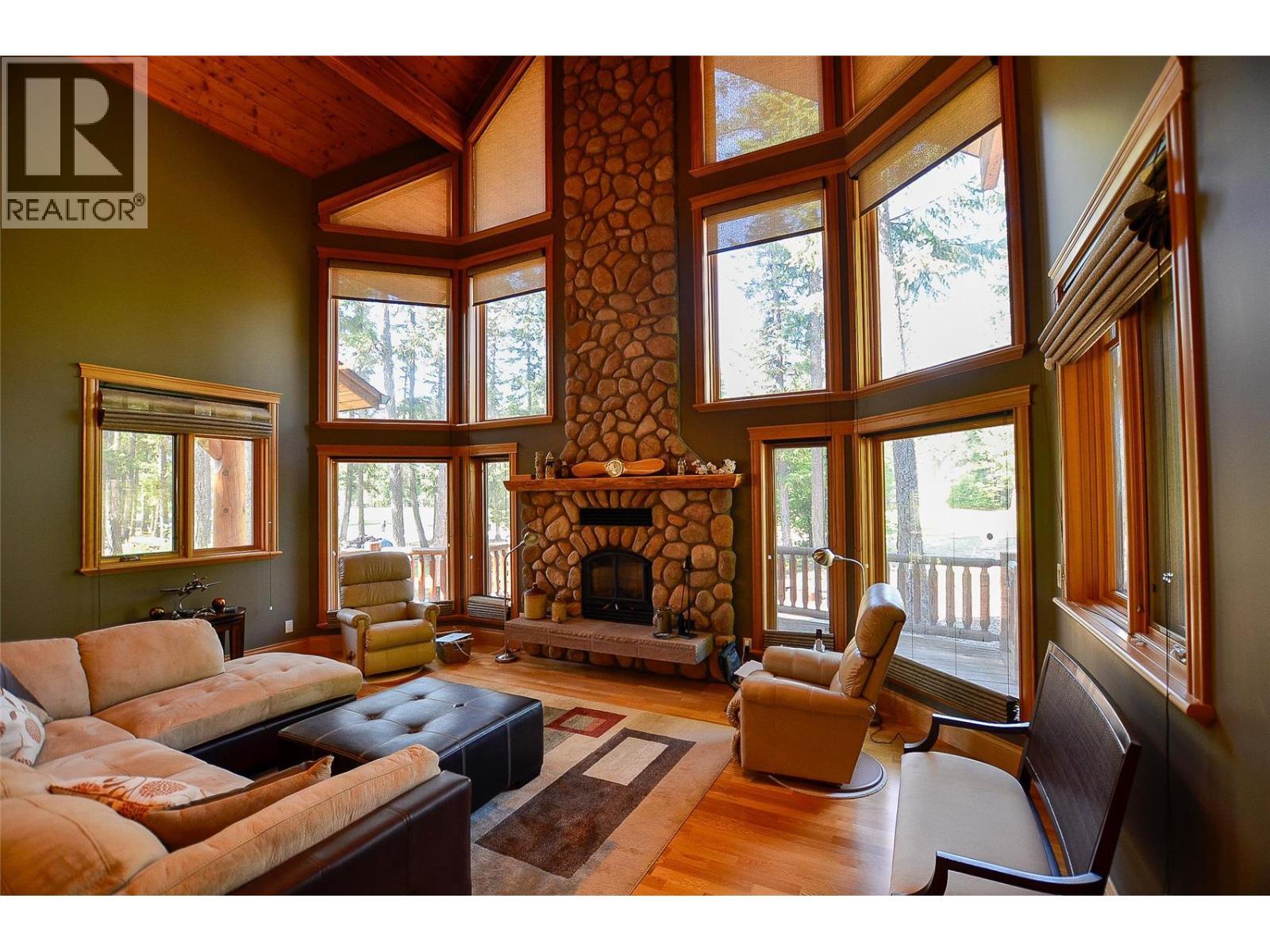 The blinds open from top and bottom so you can control both light and privacy. - 19-3453 Cessna Road, Enderby, BC - Indoor Photo Showing Living Room With Fireplace