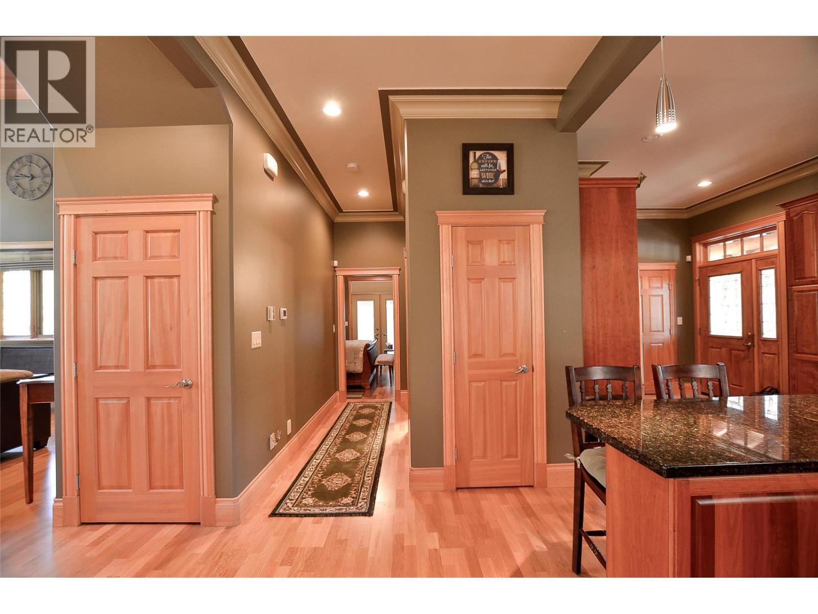Lots of storage, the hall to the main floor bedroom, and door to the basement. - 19-3453 Cessna Road, Enderby, BC - Indoor Photo Showing Other Room