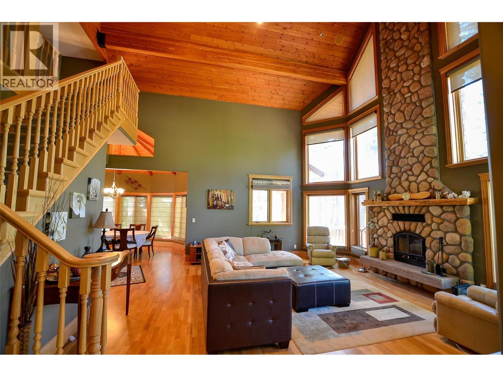 Entry from the yard into the large living room. - 19-3453 Cessna Road, Enderby, BC - Indoor Photo Showing Living Room With Fireplace