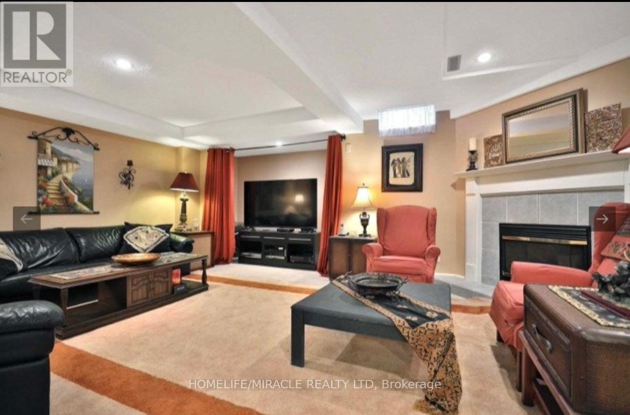 2999 Valcourt Crescent, Mississauga, ON - Indoor Photo Showing Living Room With Fireplace