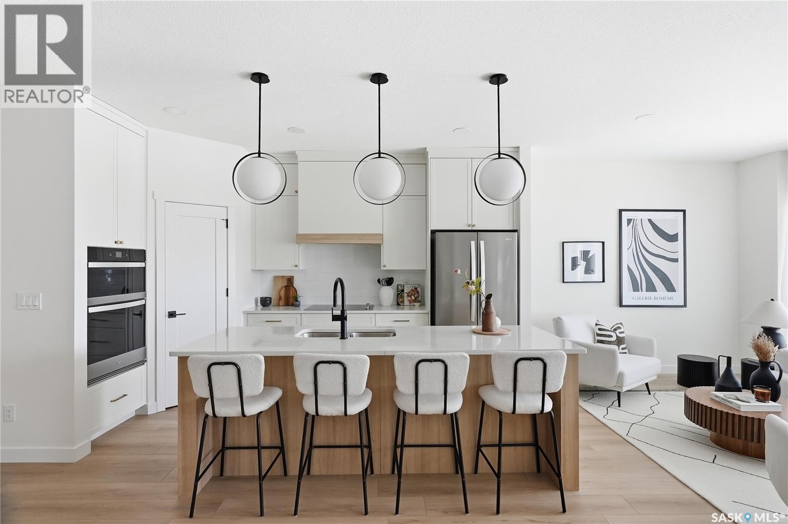 24 720 Brighton Boulevard, Saskatoon, SK - Indoor Photo Showing Kitchen With Upgraded Kitchen