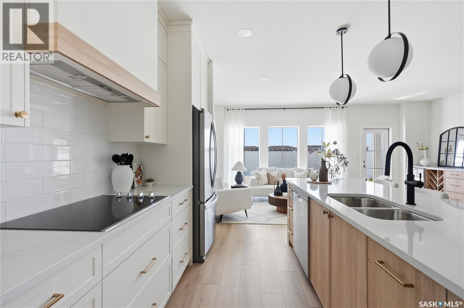 24 720 Brighton Boulevard, Saskatoon, SK - Indoor Photo Showing Kitchen With Double Sink With Upgraded Kitchen