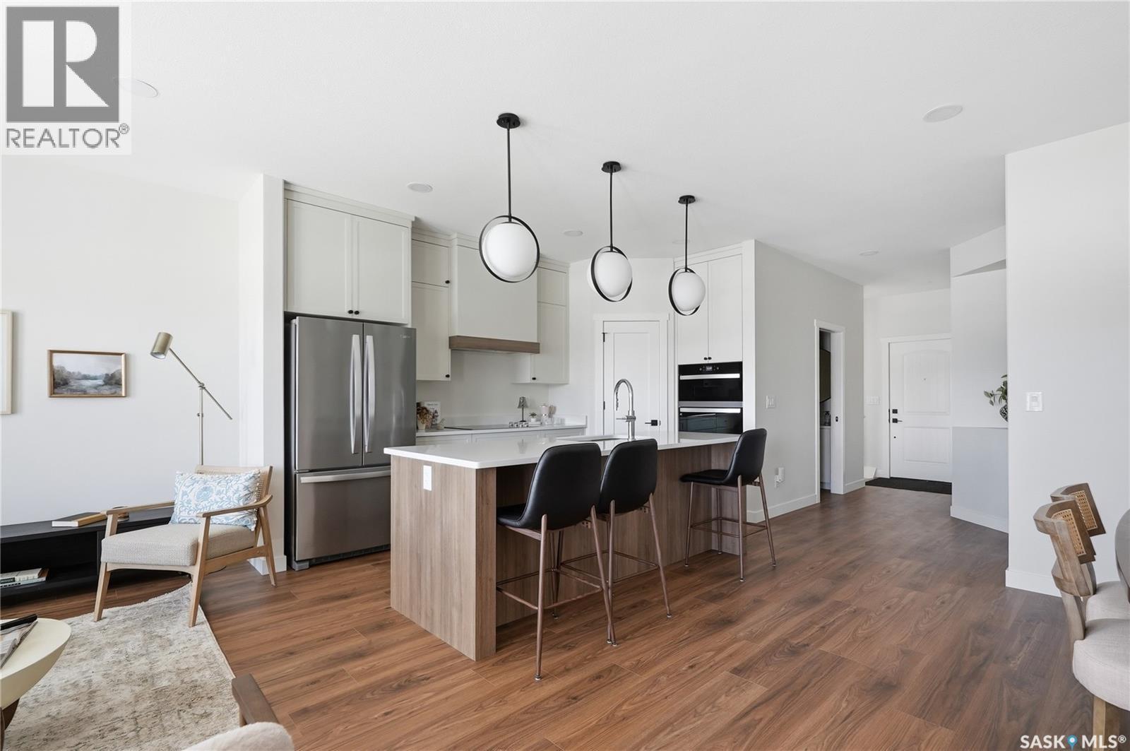 22 720 Brighton Boulevard, Saskatoon, SK - Indoor Photo Showing Kitchen With Upgraded Kitchen