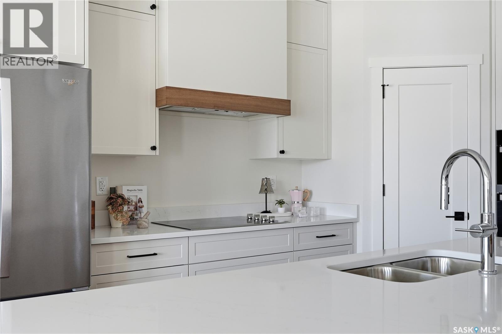 22 720 Brighton Boulevard, Saskatoon, SK - Indoor Photo Showing Kitchen With Double Sink