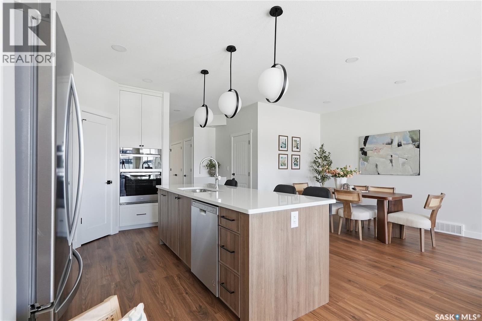 22 720 Brighton Boulevard, Saskatoon, SK - Indoor Photo Showing Kitchen With Upgraded Kitchen