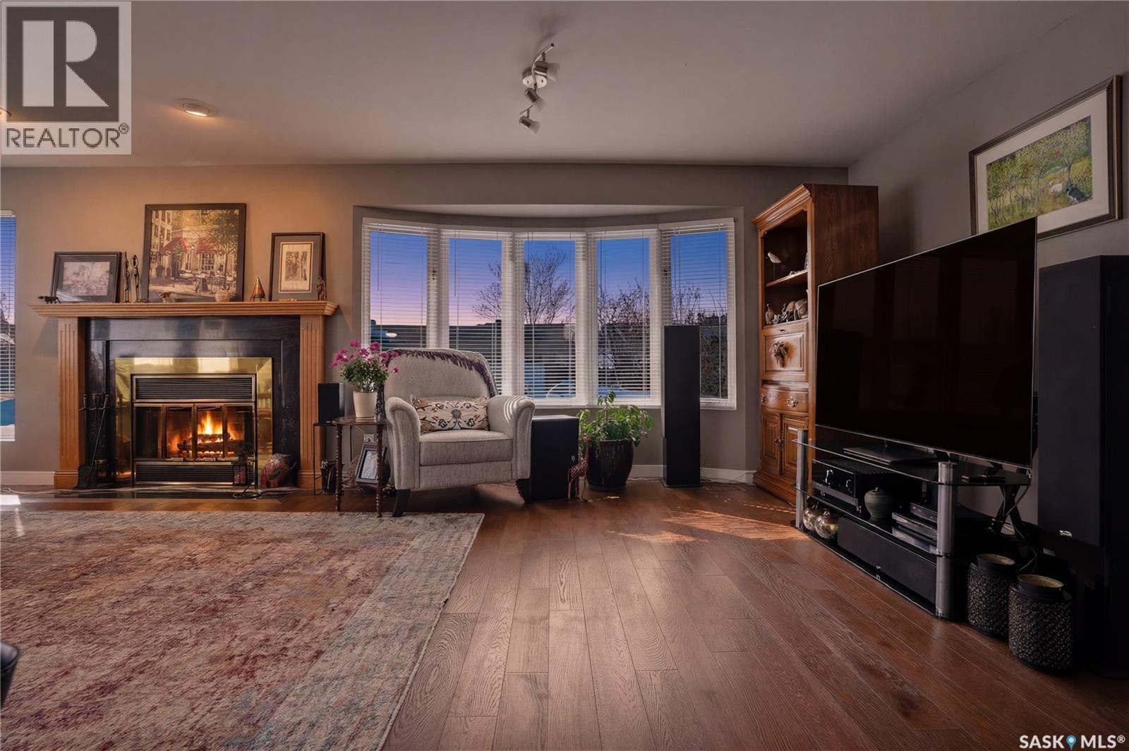 250 Bornstein Court, Saskatoon, SK - Indoor Photo Showing Living Room With Fireplace