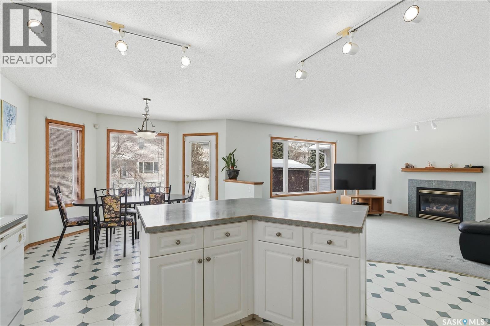 3232 Thames Crescent E, Regina, SK - Indoor With Fireplace