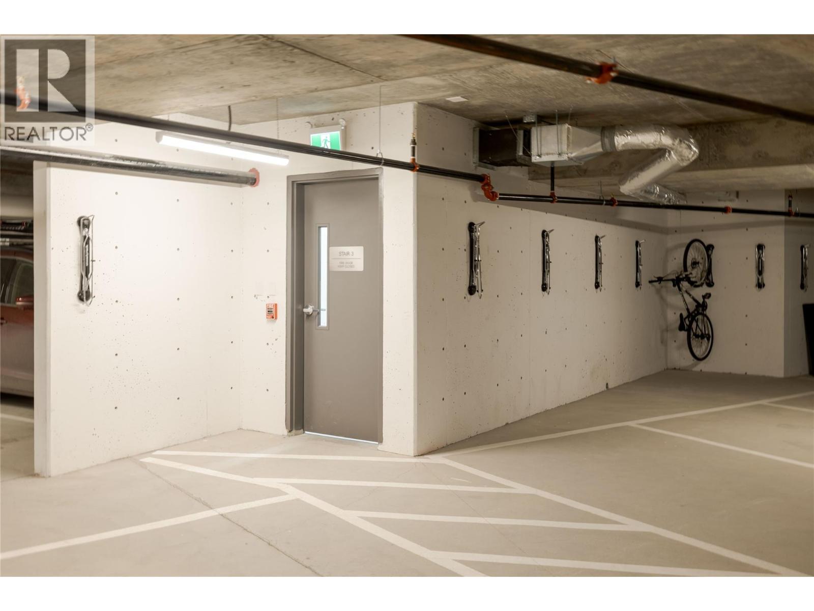 Parking - 1380 Pridham Avenue Unit# 415, Kelowna, BC - Indoor Photo Showing Garage