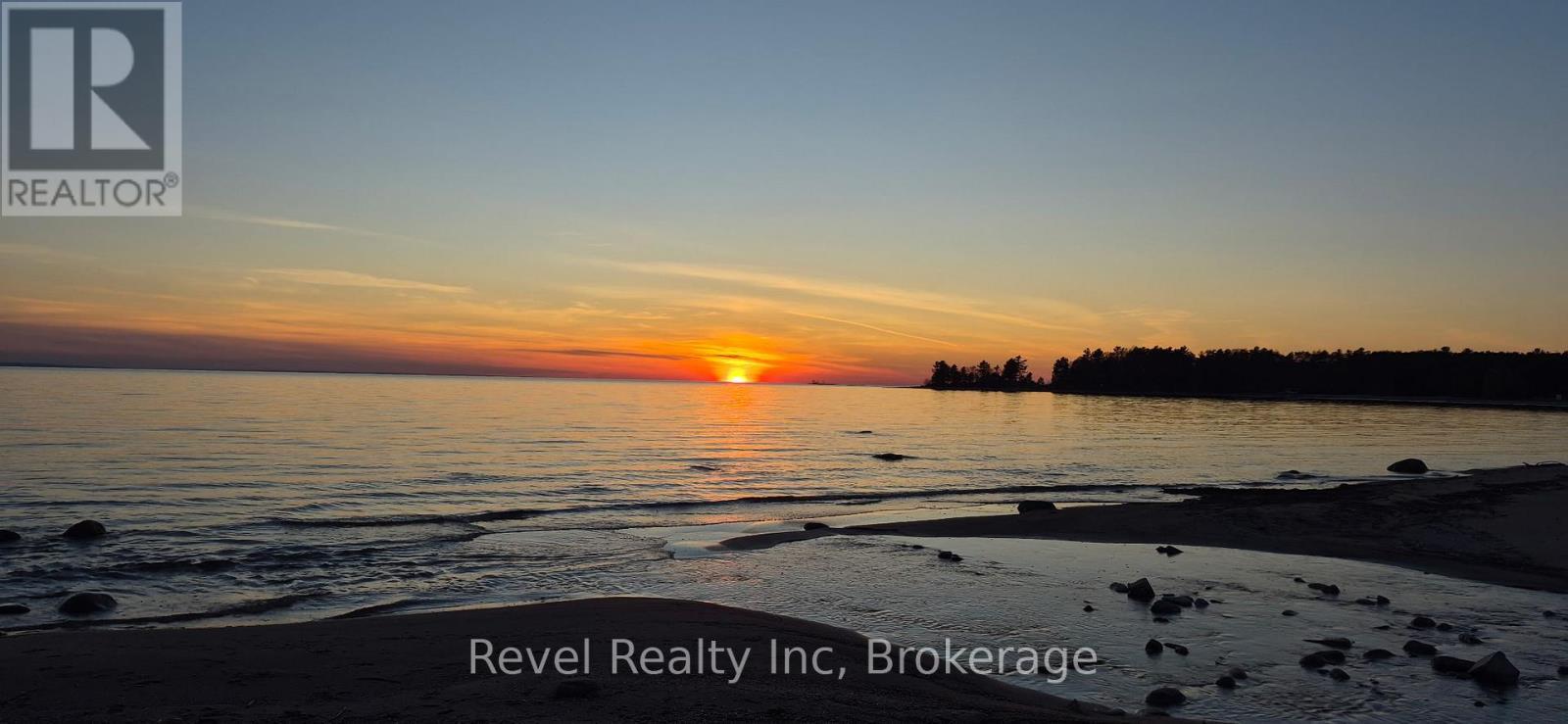 mesmerizing sunsets on the beach - 12 Walker Road, Tiny, ON - Outdoor With Body Of Water With View
