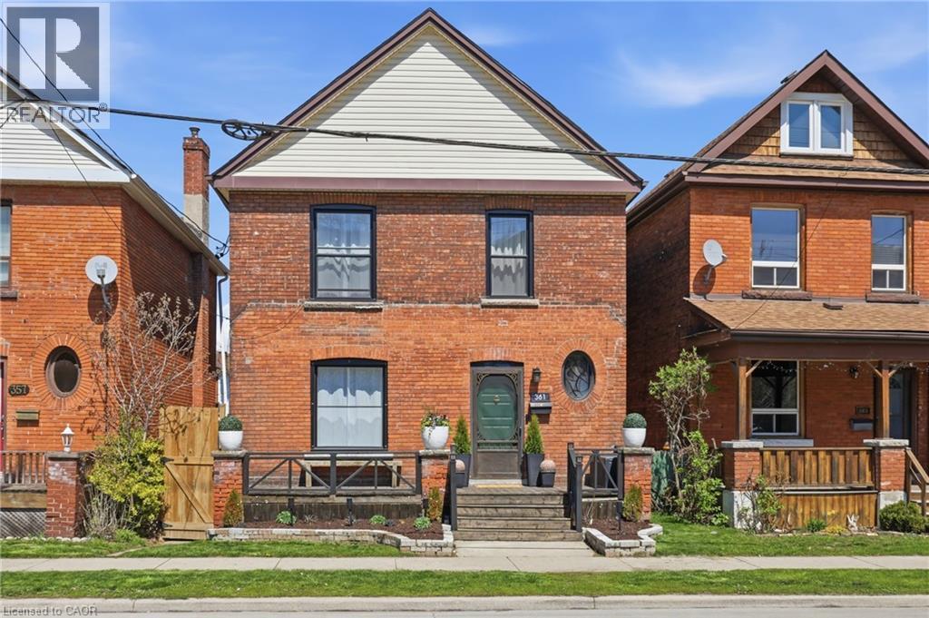 Brick exterior with a peaked gable and horizontal siding - 361 Cumberland Avenue, Hamilton, ON - Outdoor With Deck Patio Veranda With Exterior