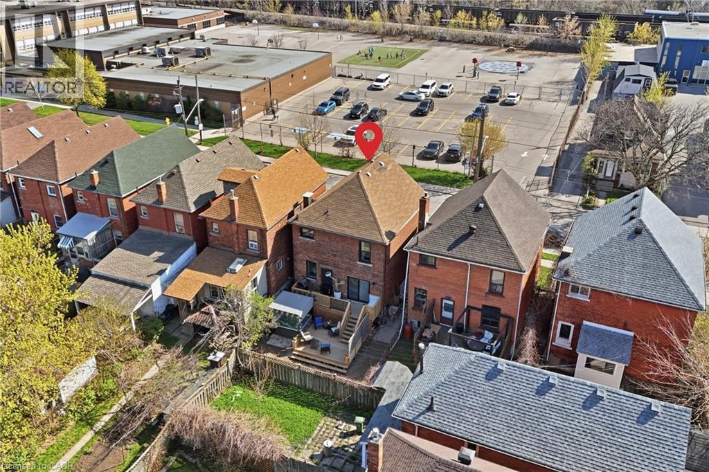Brick exterior residence featuring a rear wood deck - 361 Cumberland Avenue, Hamilton, ON - Outdoor