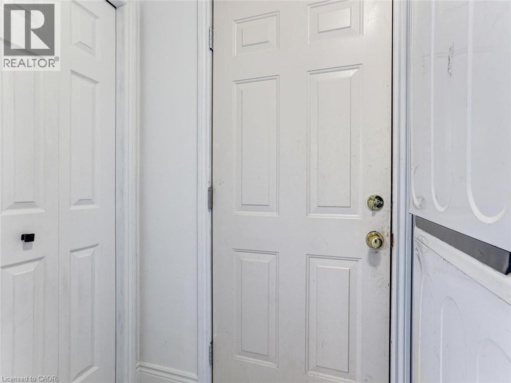 White paneled door with brass hardware - 154 Deerpath Drive, Guelph, ON - Indoor Photo Showing Other Room