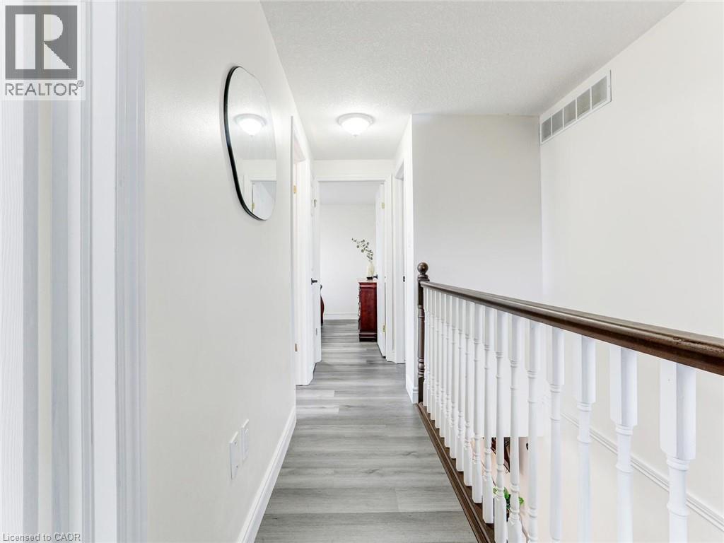 Hallway featuring wood-finish flooring, white walls, and recessed lighting - 154 Deerpath Drive, Guelph, ON - Indoor Photo Showing Other Room