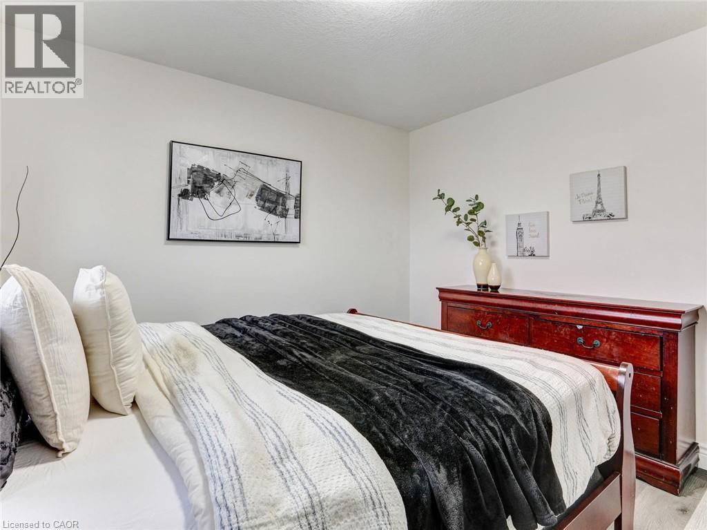 Neutral white walls provide a versatile backdrop - 154 Deerpath Drive, Guelph, ON - Indoor Photo Showing Bedroom