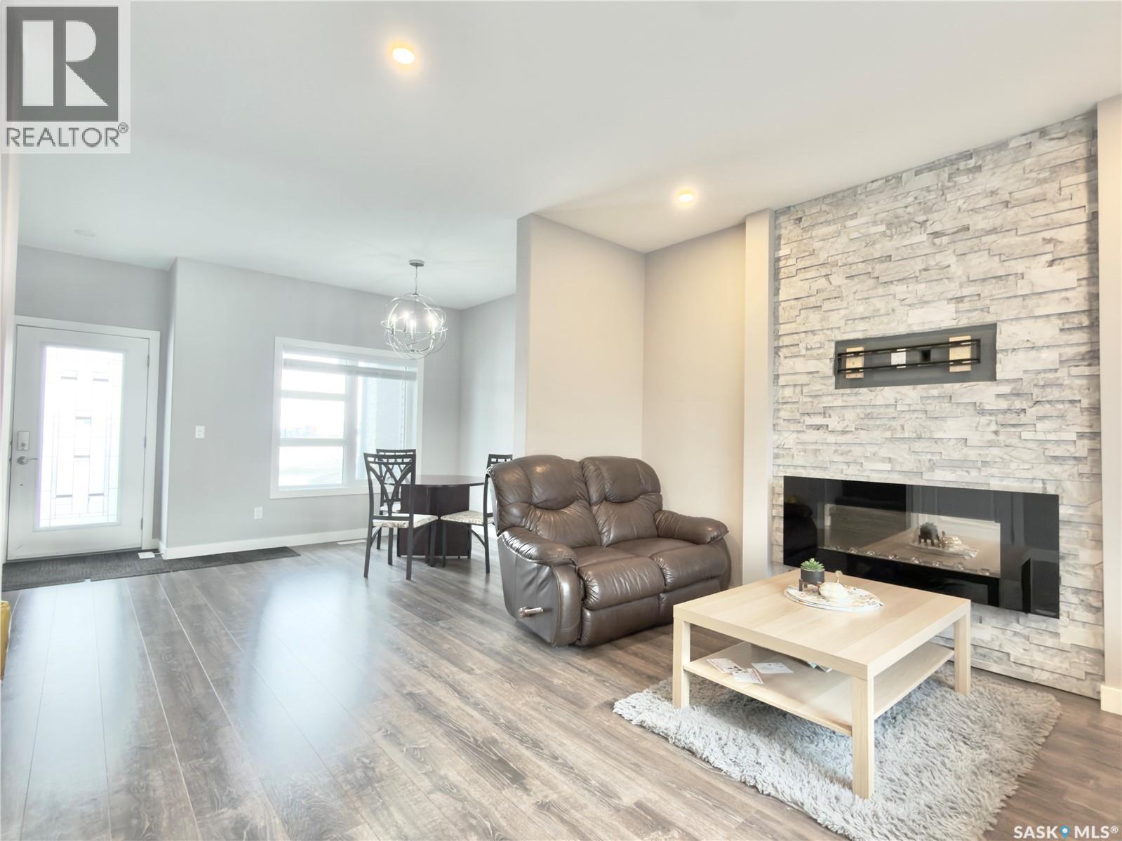 254 Brighton Gate, Saskatoon, SK - Indoor Photo Showing Living Room With Fireplace