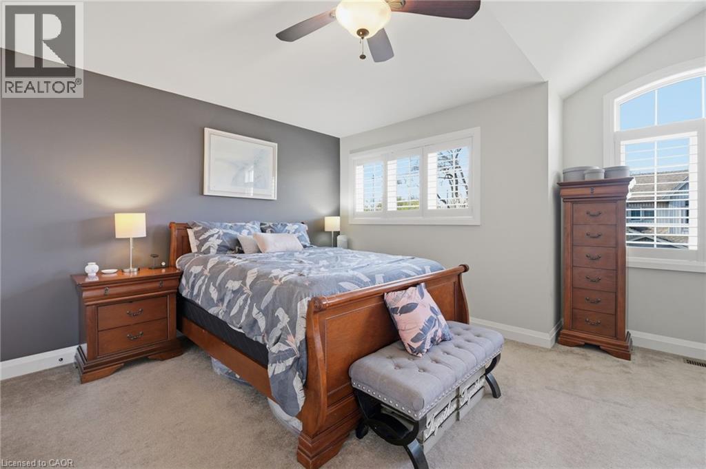 Spacious bedroom featuring light neutral carpeting and a vaulted ceiling - 7 Gibson Place Unit# 26, St. Catharines, ON - Indoor Photo Showing Bedroom