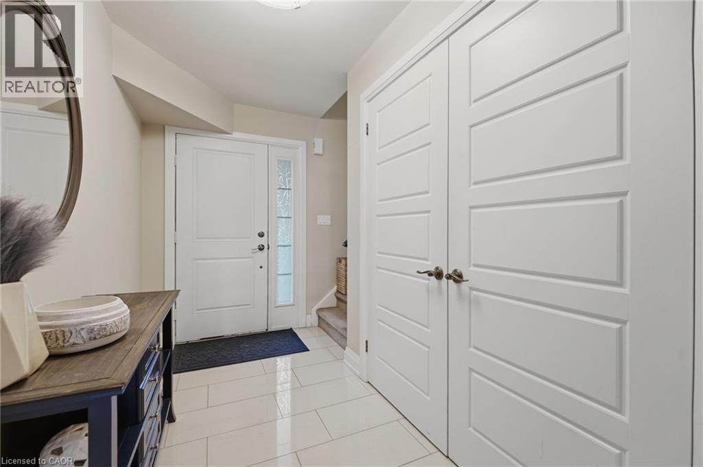 Entryway featuring white tile flooring and neutral wall tones - 7 Gibson Place Unit# 26, St. Catharines, ON - Indoor Photo Showing Other Room