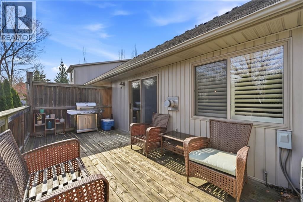 Expansive wood deck with privacy fencing and a sliding glass door entry - 7 Gibson Place Unit# 26, St. Catharines, ON - Outdoor With Deck Patio Veranda With Exterior