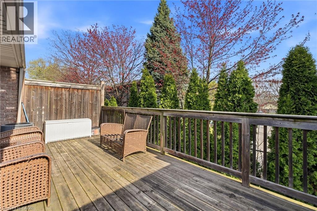Wood-finish deck with a natural wood railing - 7 Gibson Place Unit# 26, St. Catharines, ON - Outdoor With Deck Patio Veranda