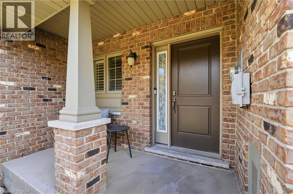 Brick facade with an inviting covered porch - 7 Gibson Place Unit# 26, St. Catharines, ON - Outdoor With Exterior