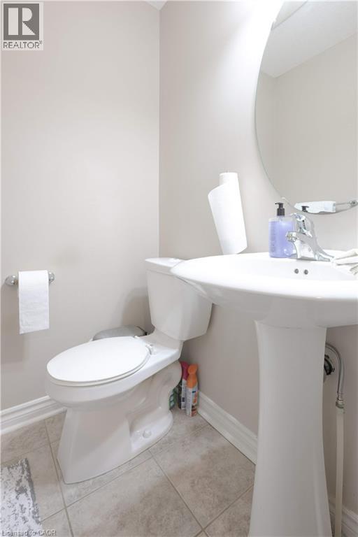 Half bath featuring light tile patterned flooring - 535 Margaret Street Unit# 74, Cambridge, ON - Indoor Photo Showing Bathroom