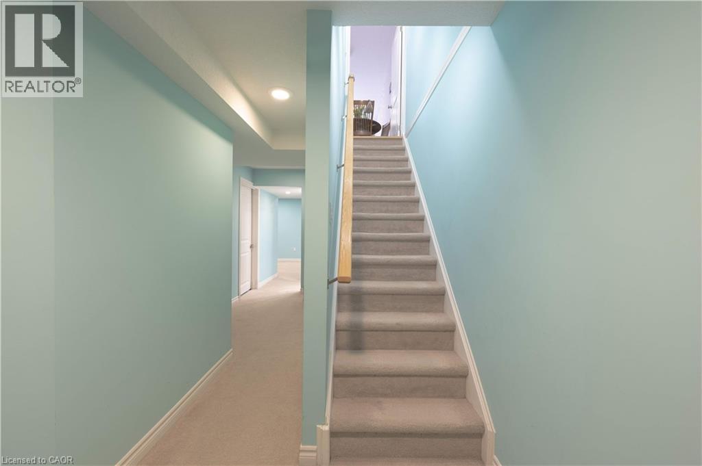 Staircase featuring carpet flooring and recessed lighting - 535 Margaret Street Unit# 74, Cambridge, ON - Indoor Photo Showing Other Room