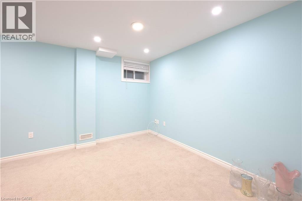 Carpeted empty room with baseboards and recessed lighting - 535 Margaret Street Unit# 74, Cambridge, ON - Indoor