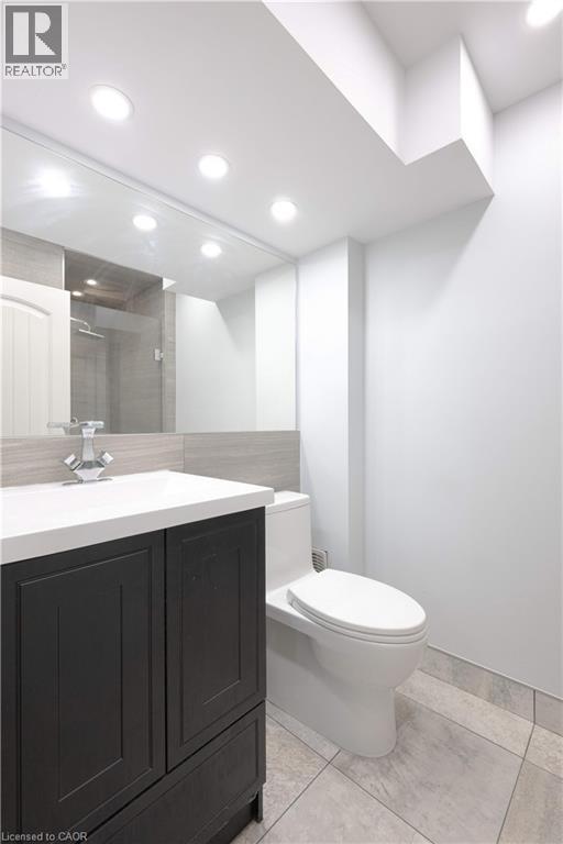 Bathroom featuring vanity, a stall shower, light tile patterned flooring, and recessed lighting - 535 Margaret Street Unit# 74, Cambridge, ON - Indoor Photo Showing Bathroom