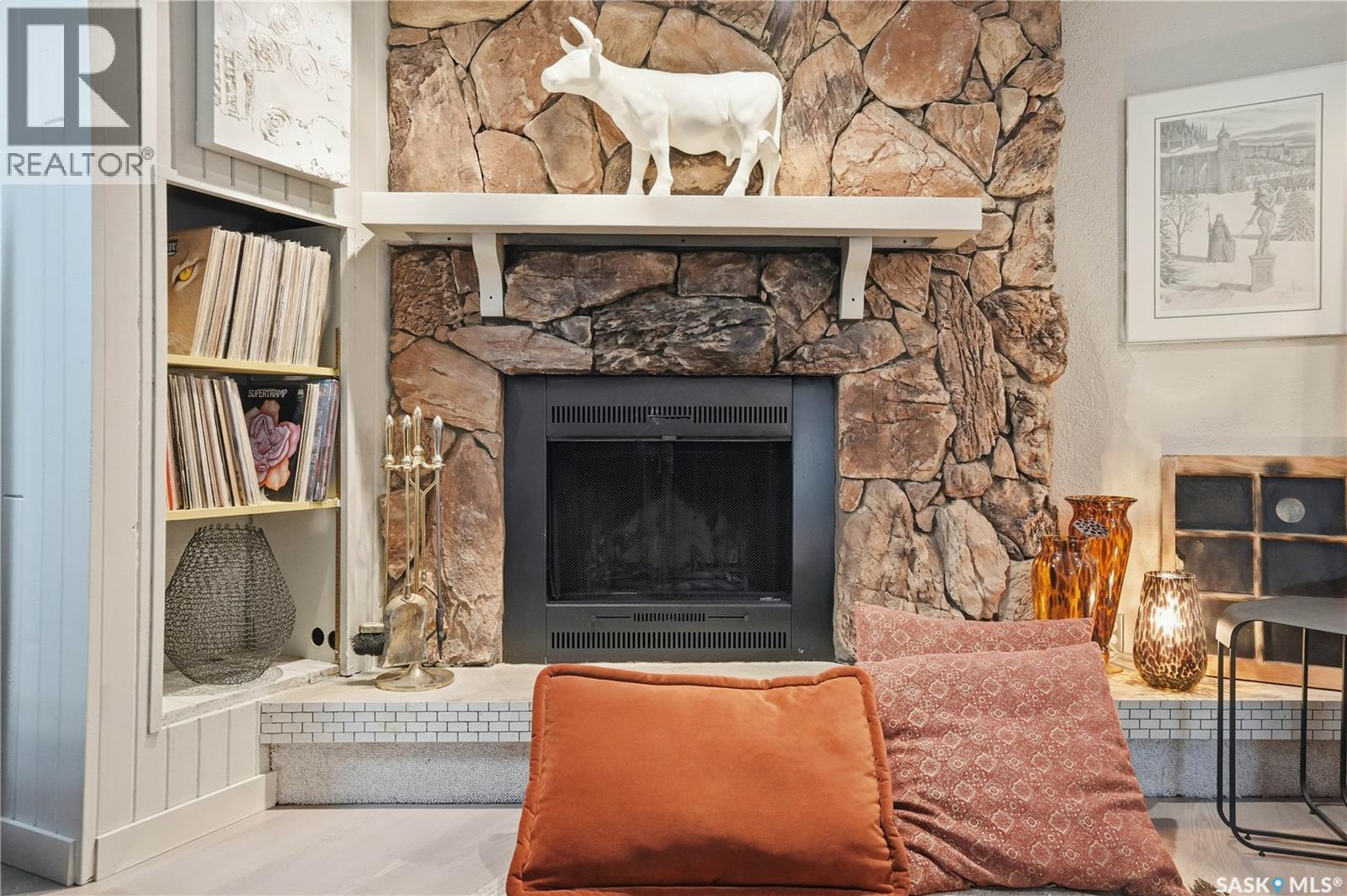 19 Tate Street, Regina, SK - Indoor Photo Showing Living Room With Fireplace