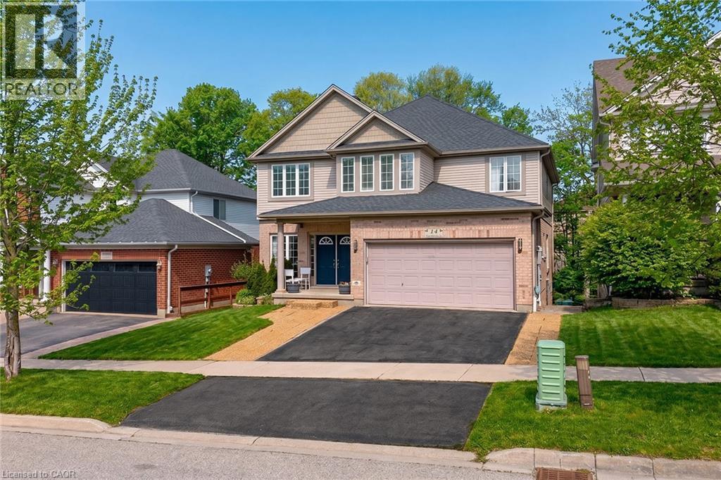 Two-story residence featuring light-toned siding and brick accents - 14 Hearthbridge Street, Kitchener, ON - Outdoor With Facade