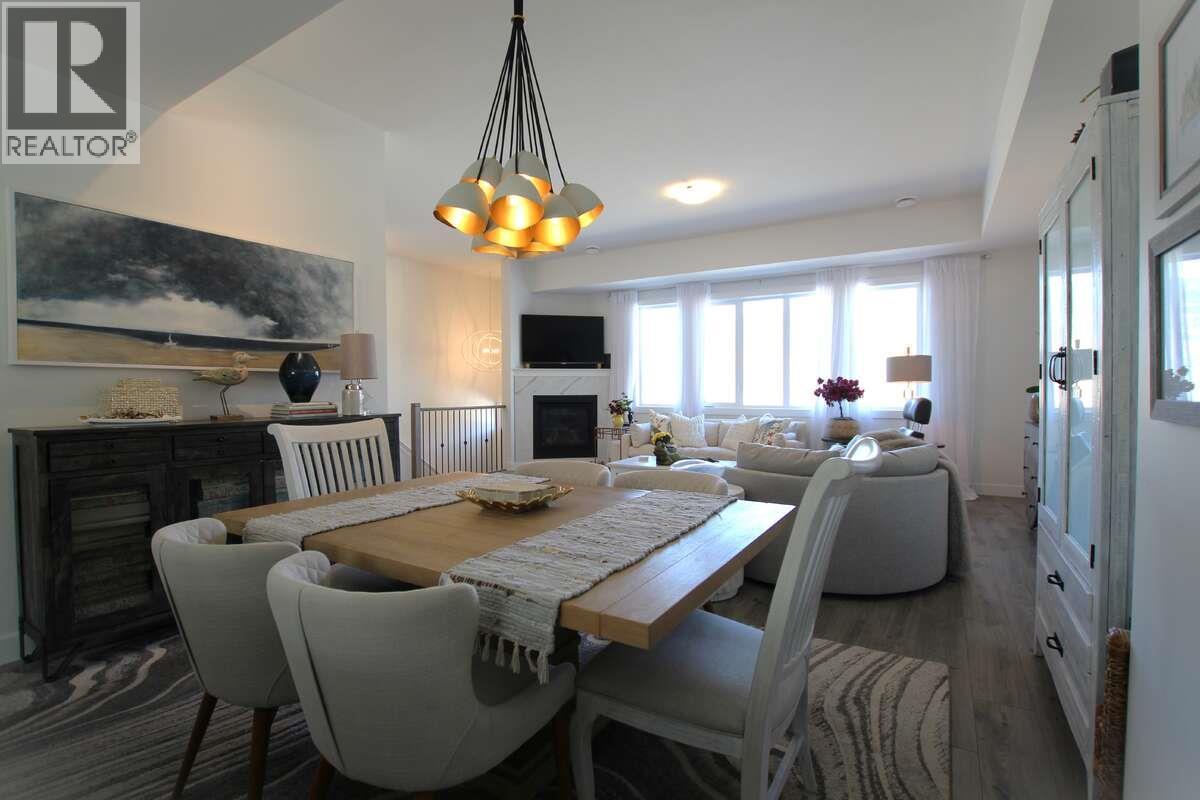 2897 Robinson Road, Lake Country, BC - Indoor Photo Showing Dining Room With Fireplace