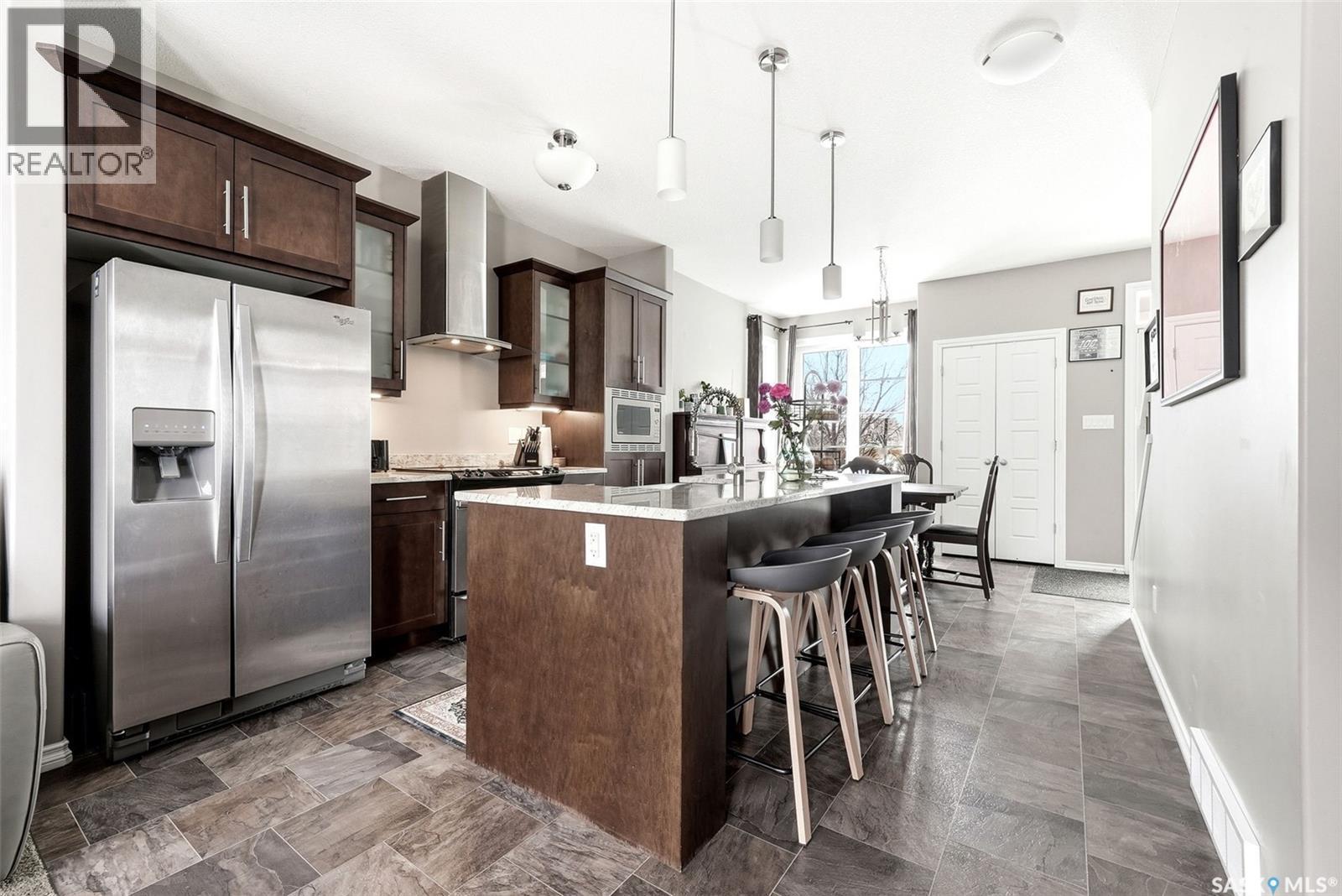 148 3229 Elgaard Drive, Regina, SK - Indoor Photo Showing Kitchen With Upgraded Kitchen