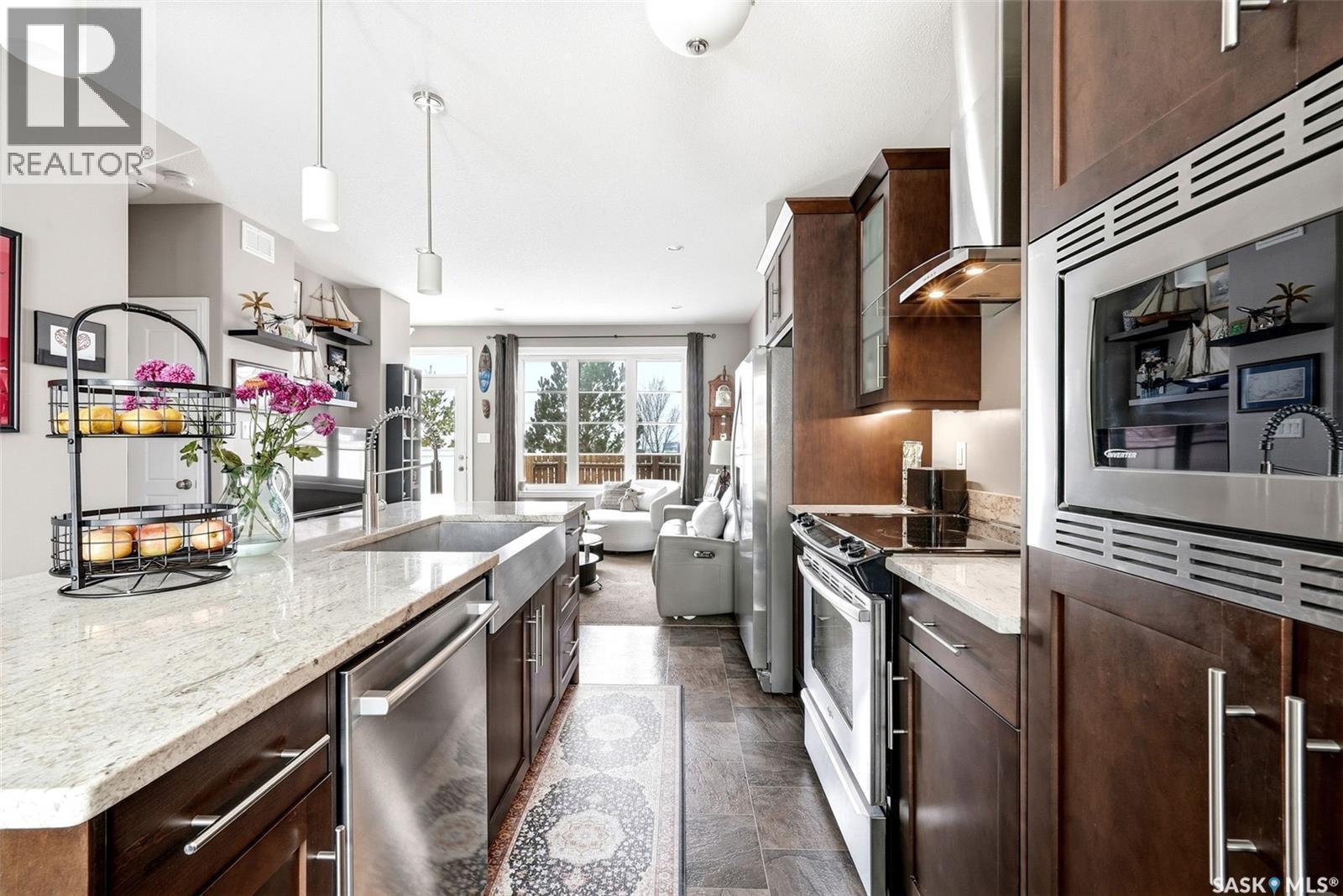 148 3229 Elgaard Drive, Regina, SK - Indoor Photo Showing Kitchen With Upgraded Kitchen