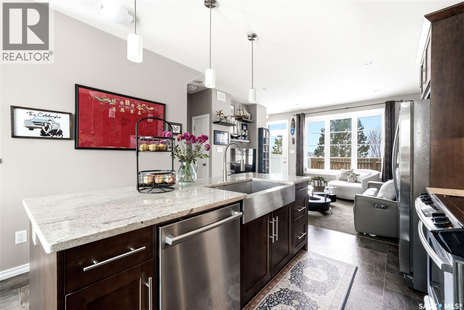 148 3229 Elgaard Drive, Regina, SK - Indoor Photo Showing Kitchen With Upgraded Kitchen