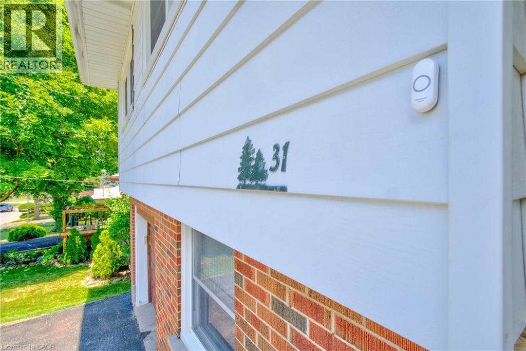 Exterior siding featuring horizontal panels and brickwork - 31 Brodick Street, Hamilton, ON - Outdoor