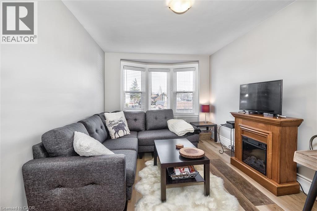 144 Ottawa Street S, Hamilton, ON - Indoor Photo Showing Living Room With Fireplace