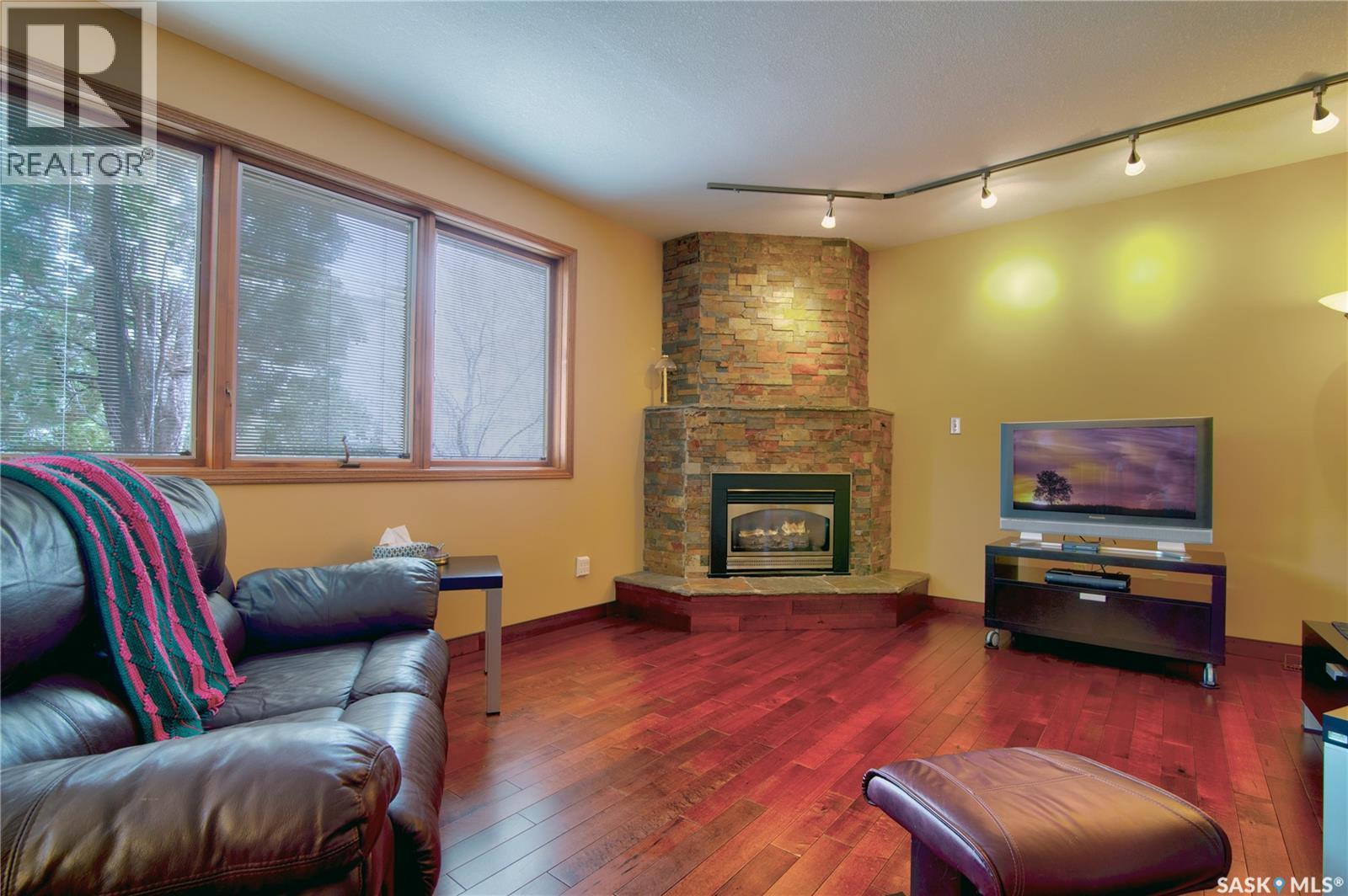3623 Hanna Bay, Regina, SK - Indoor Photo Showing Living Room With Fireplace