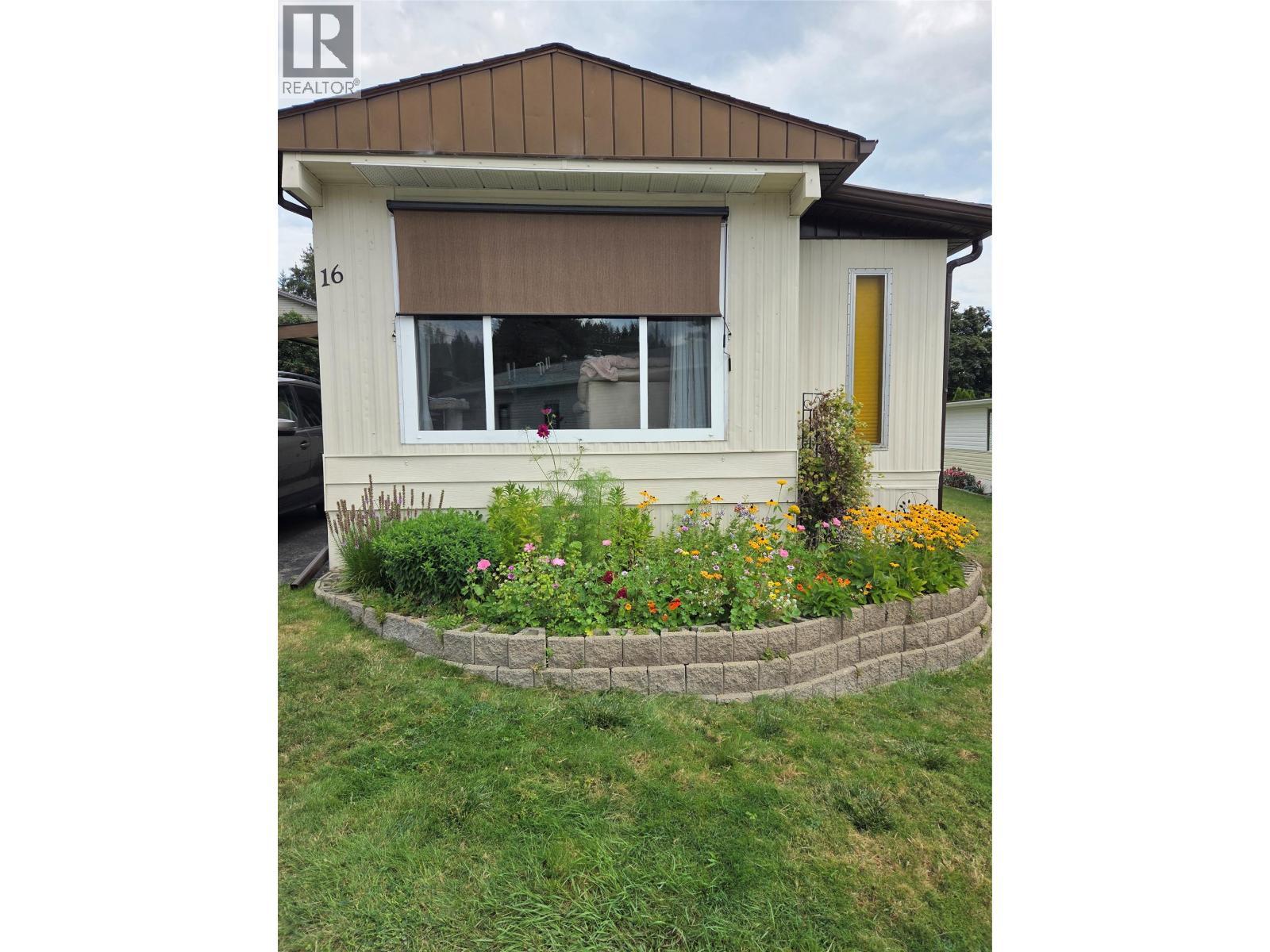 Front of the home with plants from last summer. - 12022 Pretty Road Unit# 16, Lake Country, BC