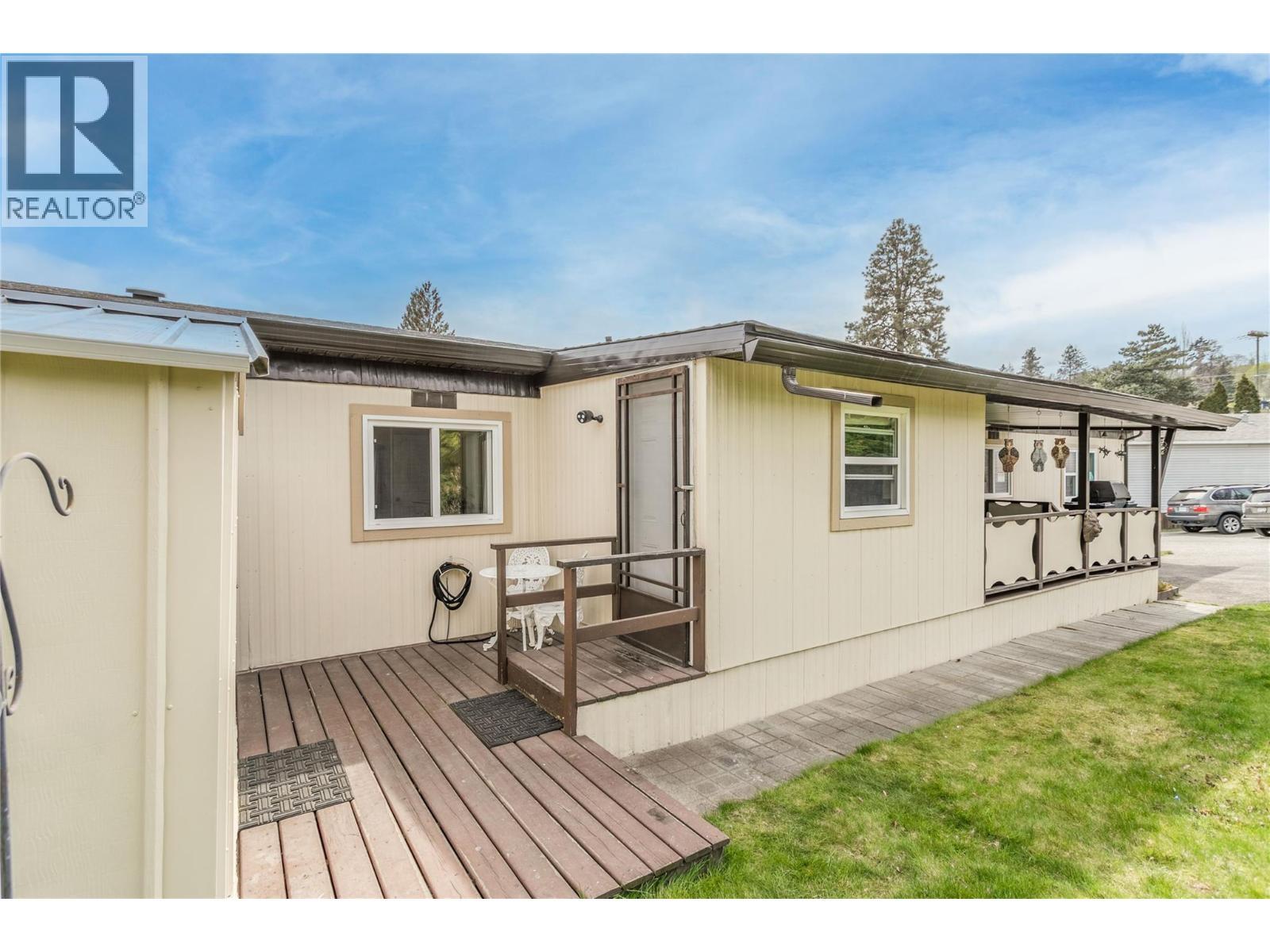 Door to the den or mud room and deck space between the home and workshop/man-cave/she-shed. - 12022 Pretty Road Unit# 16, Lake Country, BC