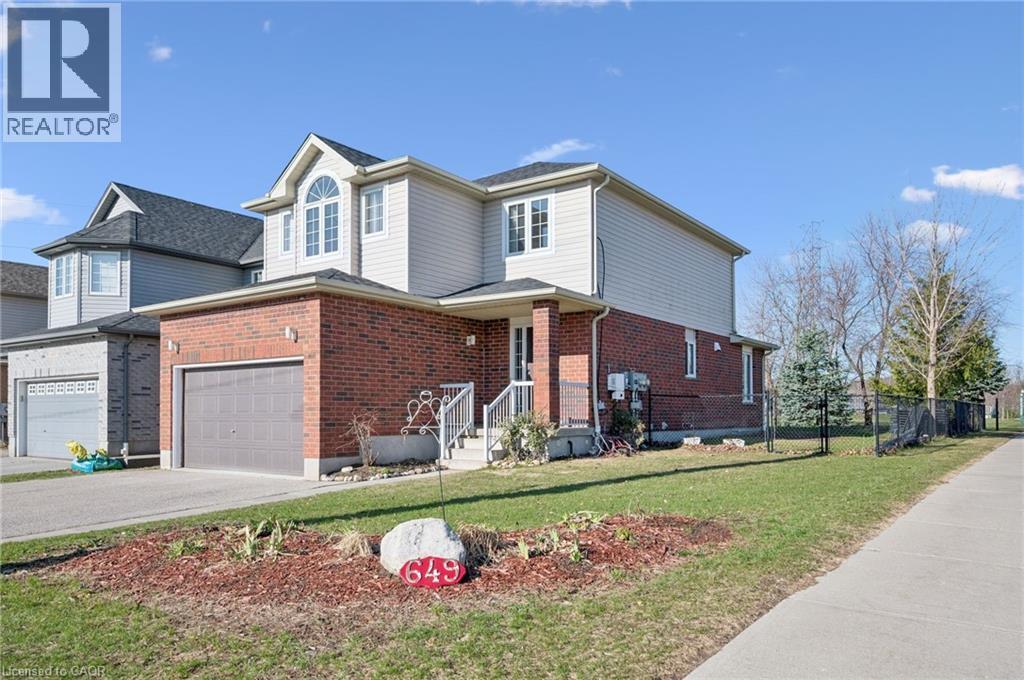 View of front of house with brick siding and driveway - 649 Doon South Drive, Kitchener, ON - Outdoor