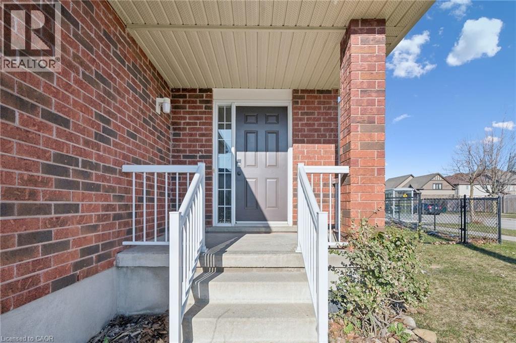 Doorway to property featuring brick siding - 649 Doon South Drive, Kitchener, ON - Outdoor With Exterior