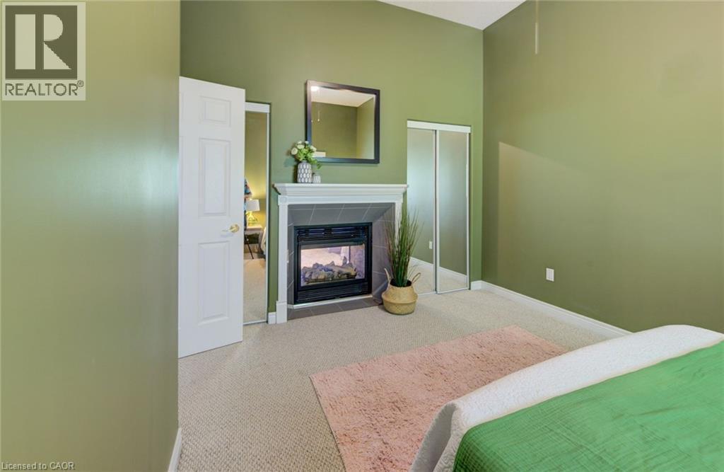 Upper unit - 2 Smetana Drive, Kitchener, ON - Indoor Photo Showing Bedroom With Fireplace