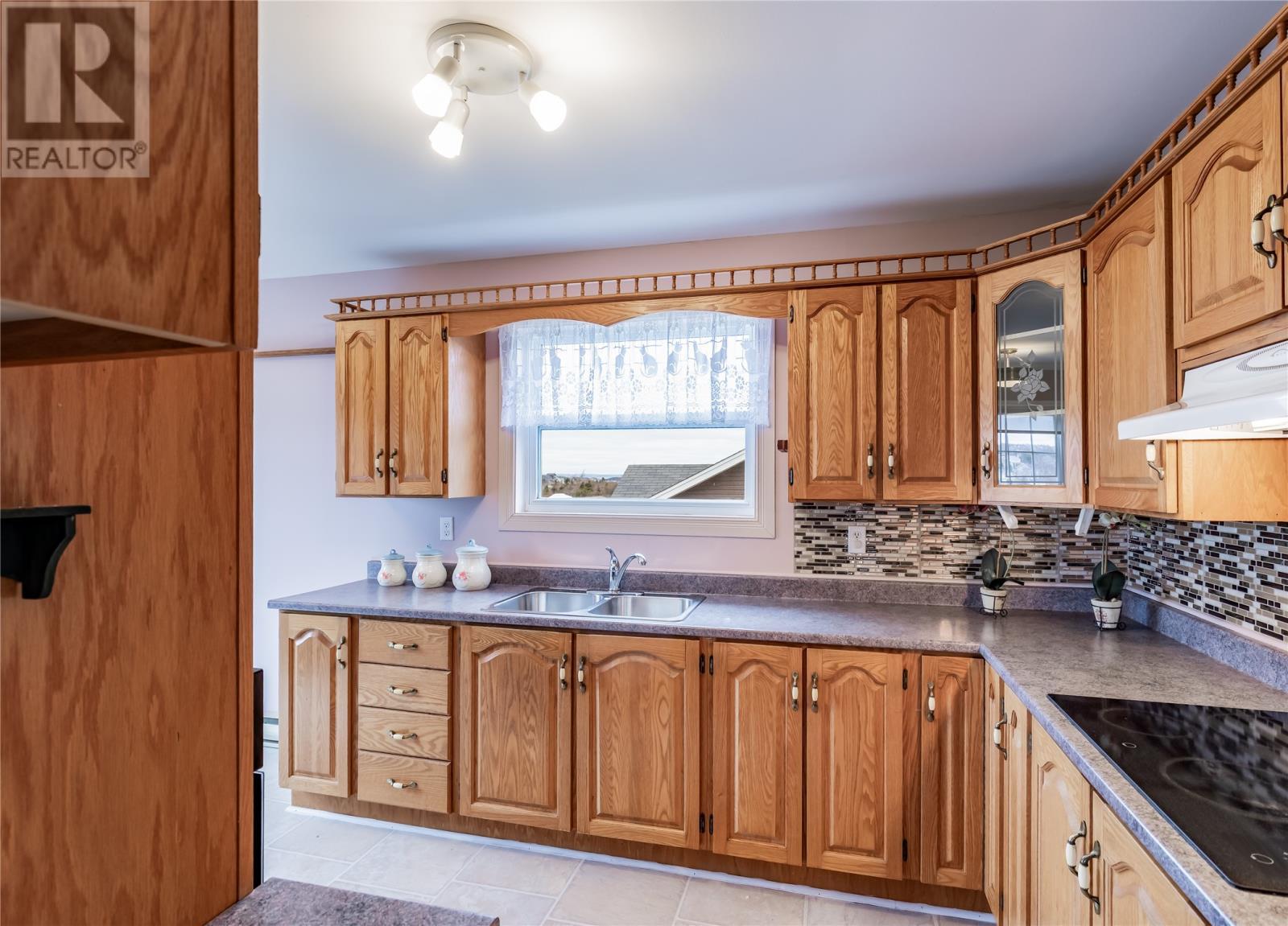 15 Greslet Place, Conception Bay South, NL - Indoor Photo Showing Kitchen With Double Sink